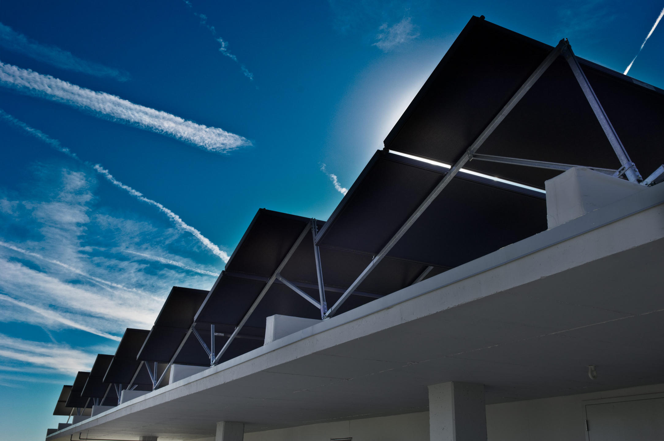 Proximity Hotel uses 100 solar panels on the hotel rooftop which generate the hot water used for the entire hotel.  The rooftop solar panels are filled with glycol which acts as a heat exchanger.  The sun's energy is transfered to generate hot water.  60% of hot water for hotel and restaurant ... that amount is equal to 100 homes use every day. : Solar Powered Hotel  : New York NY Architectural Photographer | Interior and Exterior Photography