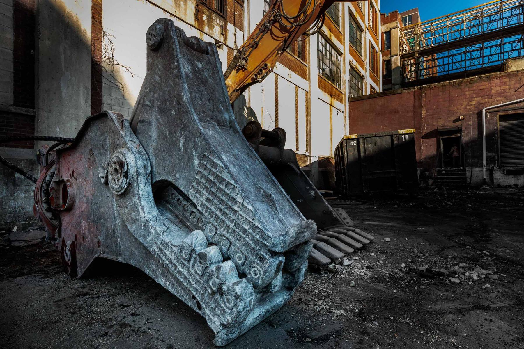Outside the building, a massive piece of demolition equipment reminds me of a Tyrannosaurus  head. : Emerson Radio Renovation : New York NY Architectural Photographer | Interior and Exterior