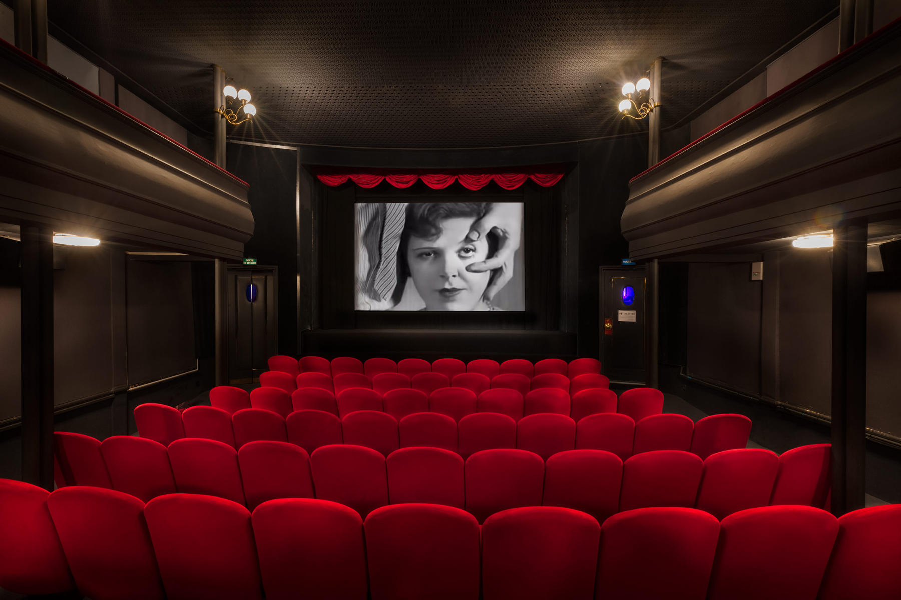 Studio des Ursulines - Paris - France.  This was the film theater where in 1929 Luis Buñuel and Salvador Dali premiered Un Chien Andalou.  The film has no plot in the conventional sense of the of the word.  With it's disjointed chronology, the story jumps from the initial "once upon a time" to "eight years later" without events or characters changing.  They incorporated a dream logic narrative flow that can be described in terms of the then popular Freudian free association, presenting a series of tenuously related scenes.  Un Chien Andalou is a seminal work in the genre of surrealist cinema. <BR />
<a href="https://www.youtube.com/watch?v=W8yKT7H_KJ0&ab_channel=MovieMatinee" target="_block"><b>View Film</b></a>
 : Miscellaneous Architectural Projects : New York NY Architectural Photographer | Interior and Exterior Photography